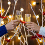 Two people toasting with champagne glasses