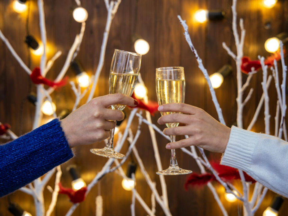 Two people toasting with champagne glasses