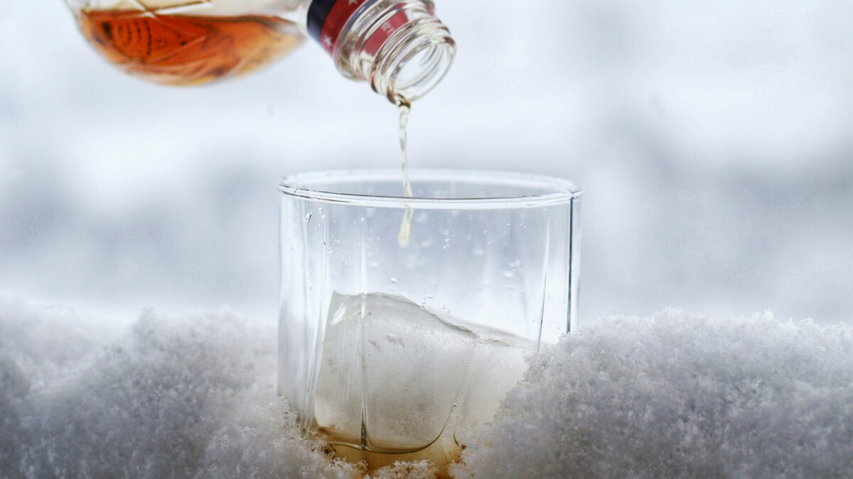 Canadian whiskey being poured into a glass