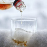 Canadian whiskey being poured into a glass