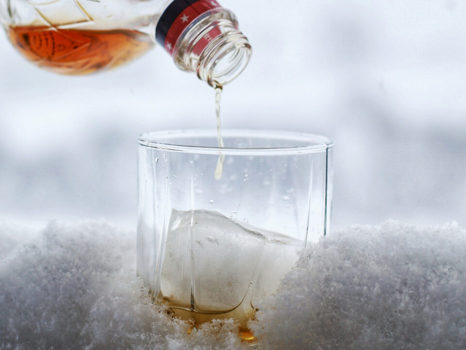 Canadian whiskey being poured into a glass