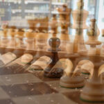 Wine bottles and superimposed chess pieces as a visual metaphor for liquor store strategic planning