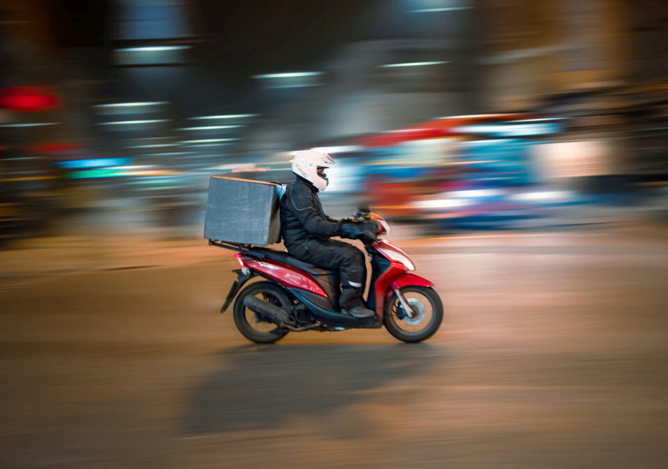 Person delivering liquor on scooter