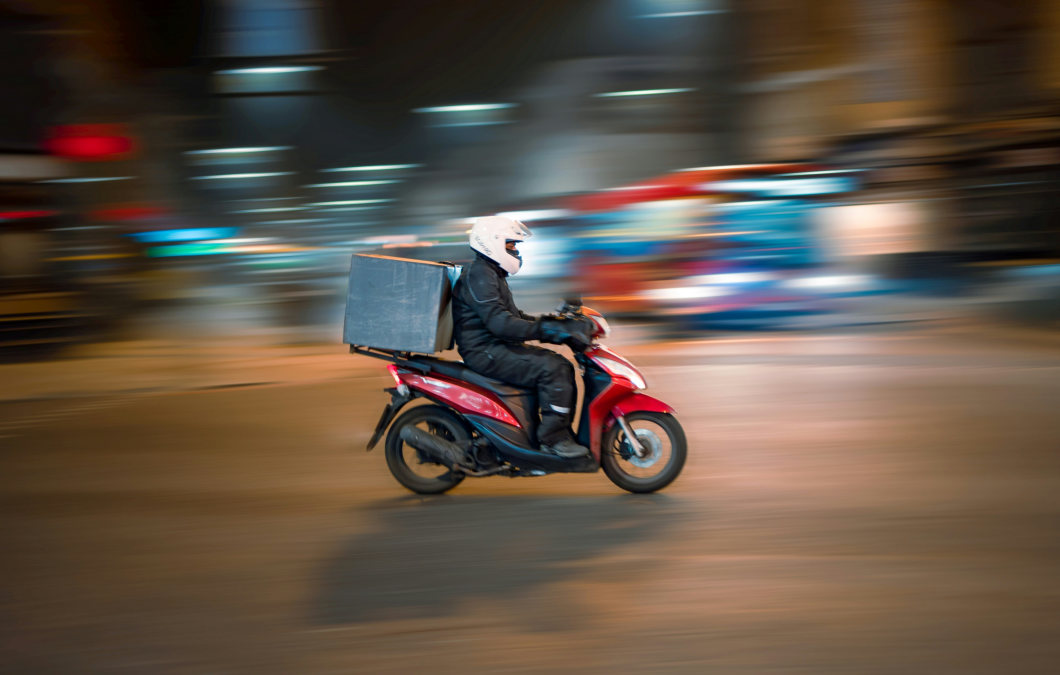 Person delivering liquor on scooter