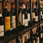 Liquor store shelves with wine bottles