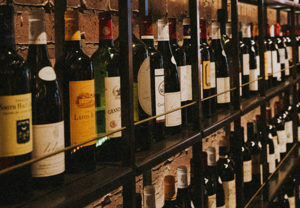 Liquor store shelves with wine bottles