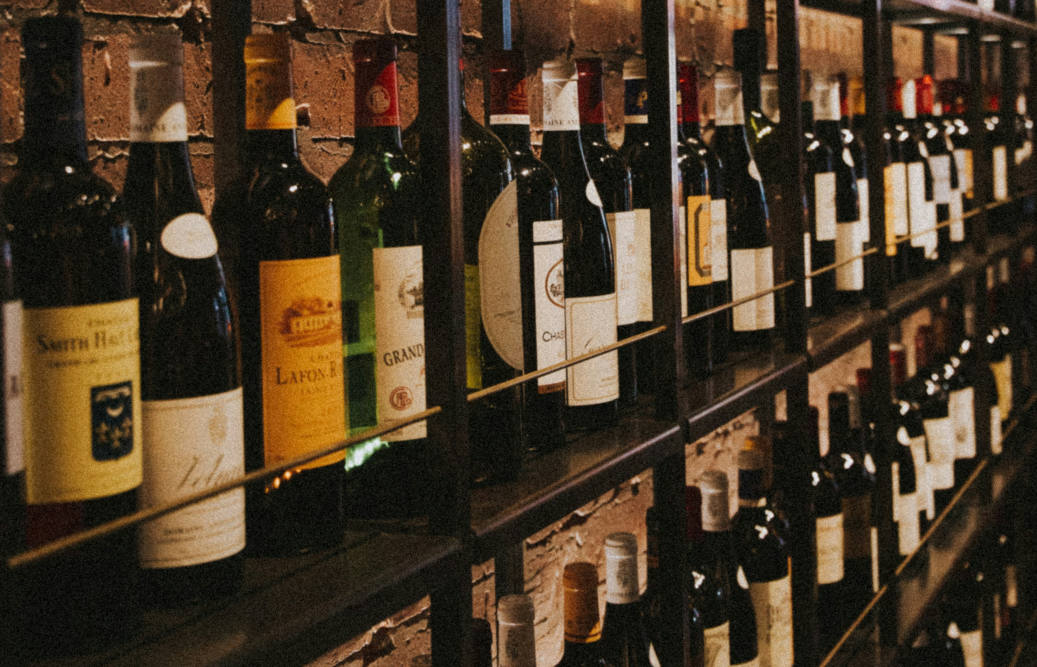 Liquor store shelves with wine bottles